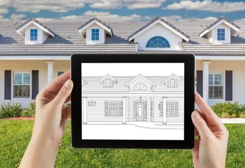 Female Hands Holding Computer Tablet with House Drawing on Screen, Photo Behi Stock Photos