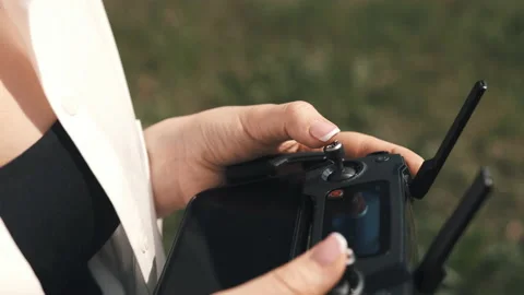 Female hands holding a controller from a drone Stock Footage 131203449