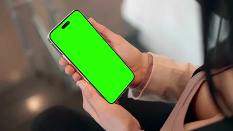 Female Hands Holding iPhone 14 Pro Close Up Shot, Cut Out Notch in Screen Green Stock Footage 208291901