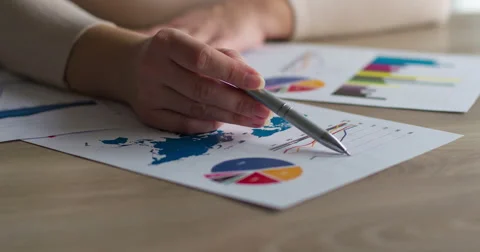 Female hands holding pen analyzing financial data Stock Footage 48689028