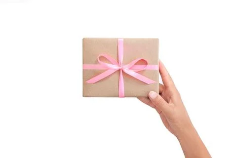 Female hands holding present box or gift box package in craft paper Stock Photos