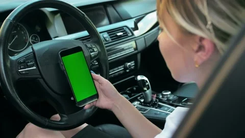 Female hands holding smartphone with vertical green screen using mobile app Stock Footage 201086196