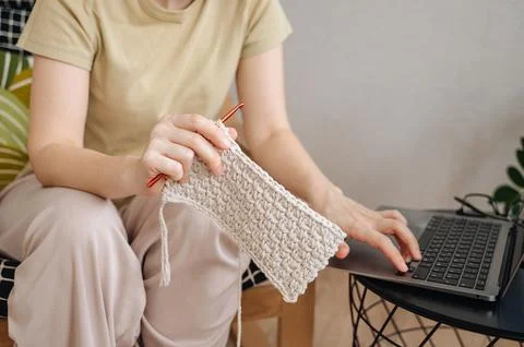 Female hands with a hook while knitting Stock Photos