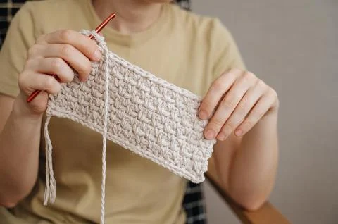 Female hands with a hook while knitting Stock Photos