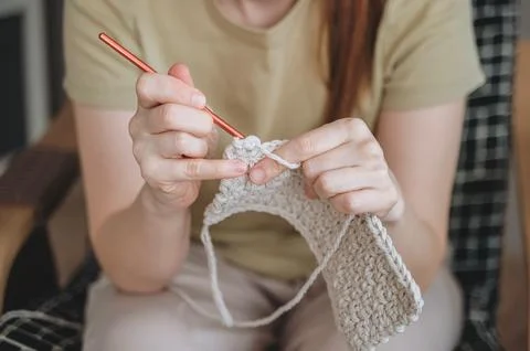 Female hands with a hook while knitting Stock Photos