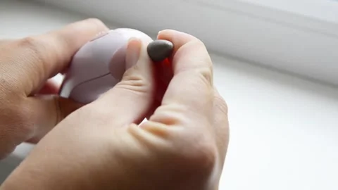 Female hands inserting a manicure drill bit into an electric nail drill machine. 스톡 동영상 339006249