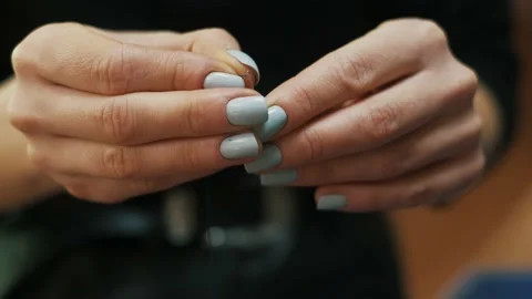 Female hands inserting thread into needle ear or hole. Stock-Footage 152187067