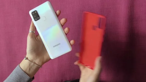 Female Hands Installing Back Cover on Smartphone. Stock Footage 149042843