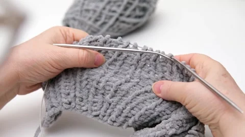Female hands knitting close-up Video stock 286971327