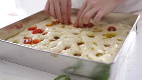 Female hands lay the dough in a baking tray, prepare Italian bread. Stock Footage 138792298