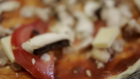 Female hands lay grated cheese on the surface of a pizza with tomato, super Stock Footage 123667258