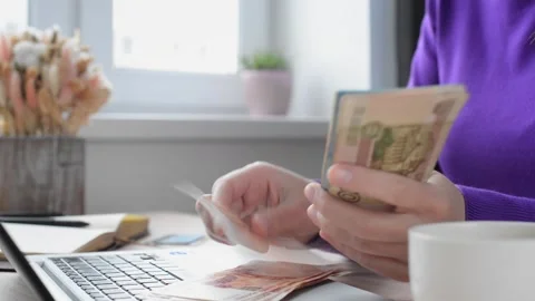 Female hands leaf through Russian banknotes Stock Footage 194565870