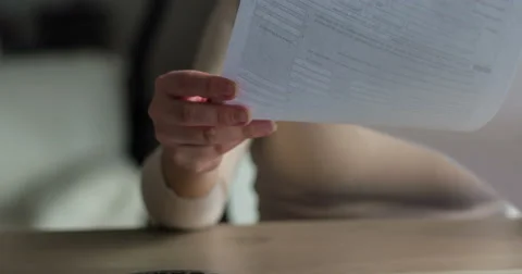 Female hands listing through the documents Stock Footage 48687549
