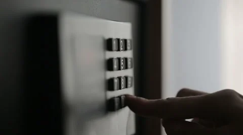 Female hands locking combination to safe in the hotel room Stock Footage 48658052