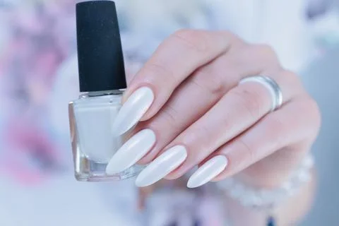 Female hands with long nails light white manicure 스톡 사진