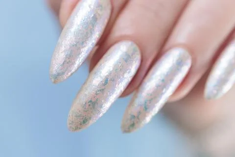 Female hands with long nails light white manicure Stock Photos