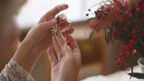 Female hands look for a beautiful ring. The concept of women's gatherings Stock Footage 186973092
