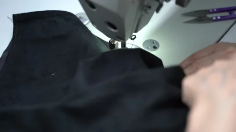 Female Hands Make A Line On Denim. Close Up Of A Sewing Machine Needle. Stock Footage 223379796