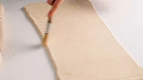 Female hands make puff yeast dough at home kitchen. Slow motion food. Stock Footage 128074682