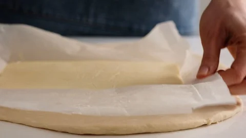 Female hands make puff yeast dough at home kitchen. Slow motion food. Stock Footage 128074854