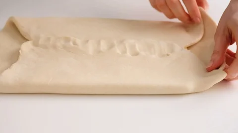 Female hands make puff yeast dough at home kitchen. Slow motion food. Stock Footage 128074982