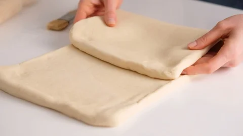 Female hands make puff yeast dough at home kitchen. Slow motion food. Stock Footage 128075185