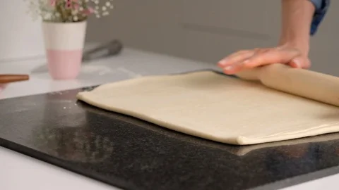 Female hands make puff yeast dough at home kitchen. Slow motion food. Stock Footage 128075454