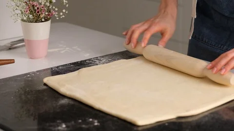 Female hands make puff yeast dough at home kitchen. Slow motion food. Stock Footage 128075502