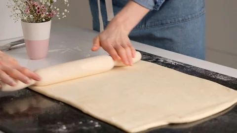 Female hands make puff yeast dough at home kitchen. Slow motion food. Stock Footage 128075505