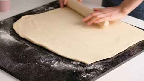 Female hands make puff yeast dough at home kitchen. Slow motion food. Stock Footage 128076863