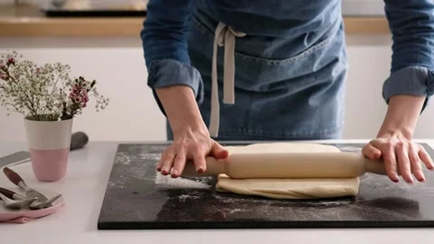 Female hands make puff yeast dough at home kitchen. Slow motion food. Stock Footage 131768245
