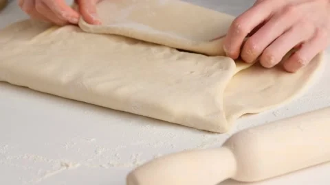 Female hands make puff yeast dough at home kitchen. Stock Footage 131768405