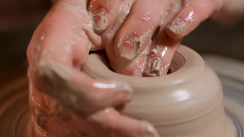 Female Hands Making Clay Pot On The Ceramic Wheel. Pottery. Clos-up. Video stock 169710036