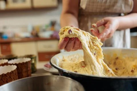 Female hands making dough for baking. Close up Stock Photos