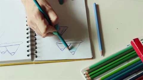 Female hands making drawing coloring sketch for stained window glass jewelry  動画素材 89647589
