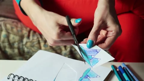 Female hands making drawing coloring sketch for stained window glass jewelry  Video stock 89685109