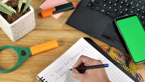 Female hands making important notes about business development and planning -... Stock Footage 152749085