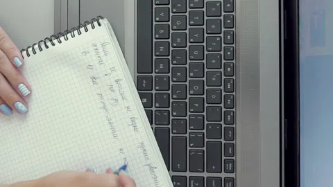 Female hands making notes in paper notebook by pen Stock-Footage 90422748