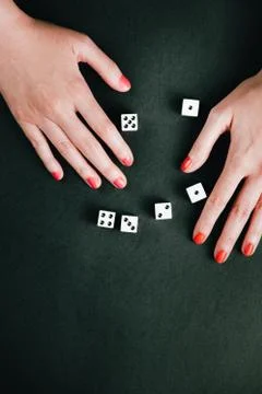 Female hands making a number sequence with rolling dices. White square dices  Stock Photos