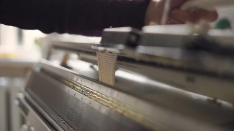 Female hands making textile on weaving machine at table in workshop Stock Footage 87453154