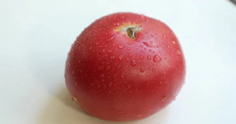 Female hands with multi-colored manicure cut and peel a tomato Video stock 133827634