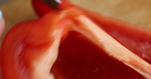 Female hands with multi-colored manicure chop bell pepper Stock Footage 133831004