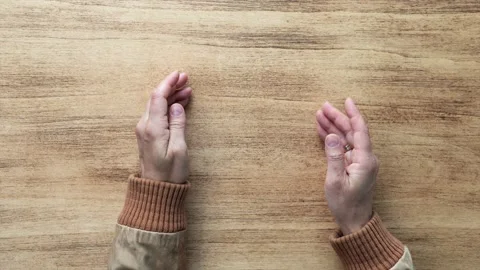 Female hands open empty space for text on wooden background, top view Stock Footage 220282923