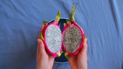Female hands open Pitaya Stock-Footage 243187489