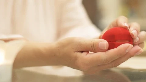Female hands open the red box with engagement ring. Stock Footage 77828401