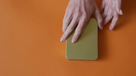 Female hands opened a box full of weed and test hemp buds on red background Stock Footage 112306676