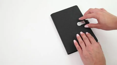 Female hands opening a notebook. Stock Footage 46530884
