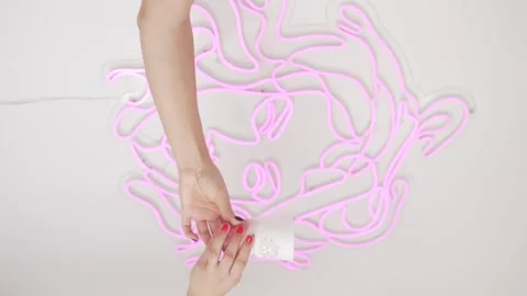 Female hands passing a plastic cup of coffee, against the background of a white Stock Footage 301297128