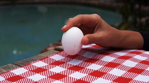 Female hands peel off an eggs shell on table 動画素材 120249758