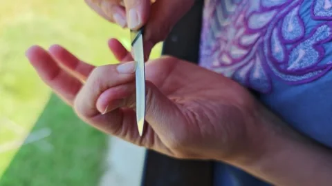 Female hands performing precise nail filing technique with metal nail file Stock-Footage 315360042
